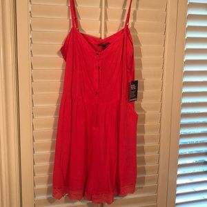 Pink button up romper with pockets